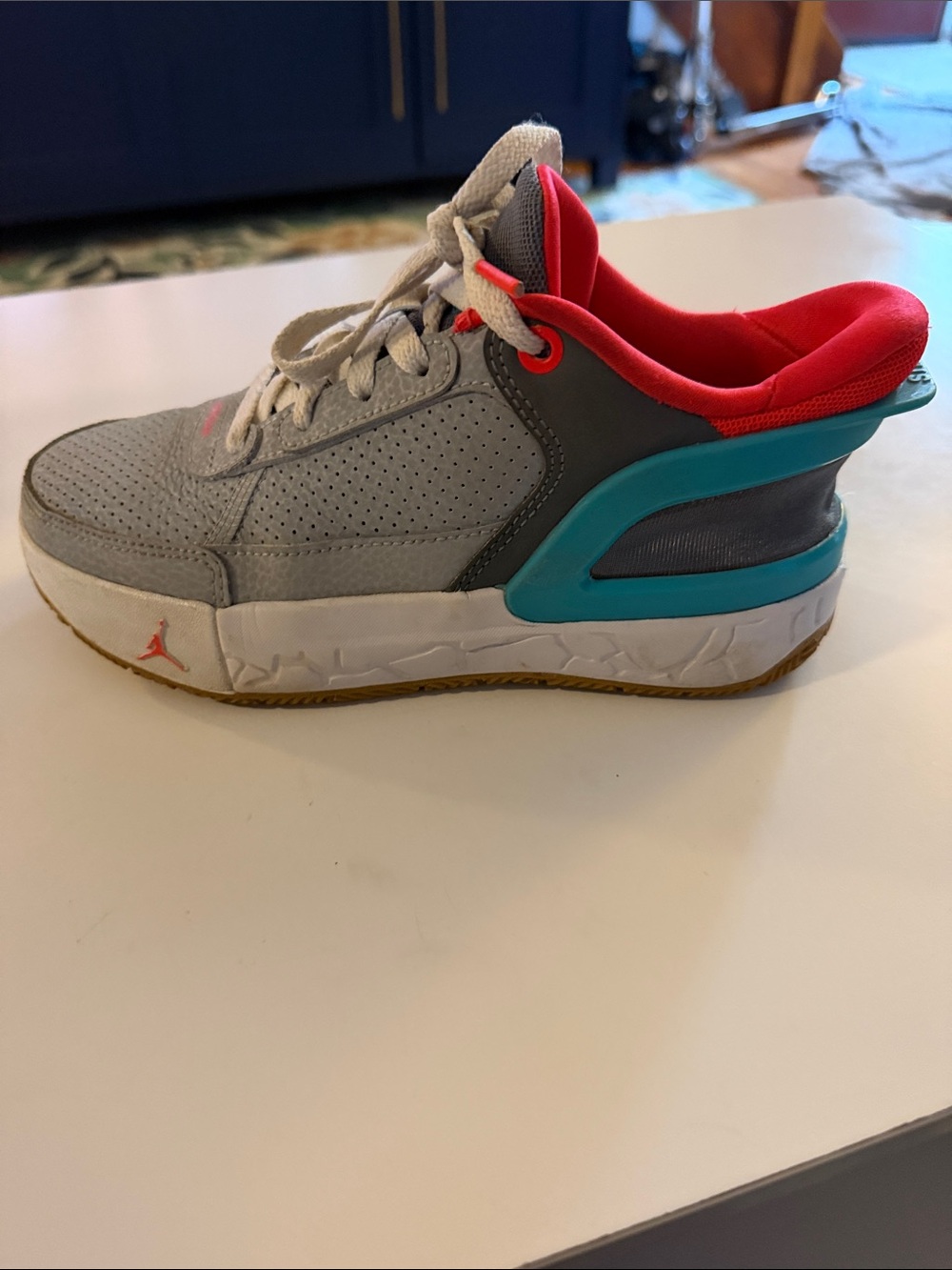 Jordan Kids Light Gray Sneakers with Pink and Teal Accents. Easy slide in heal